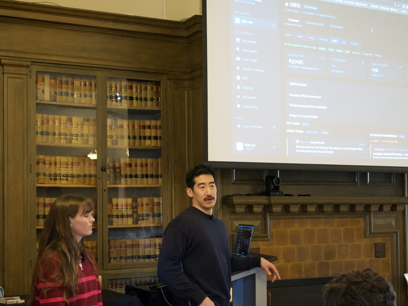 A participant presents their project on the big screen